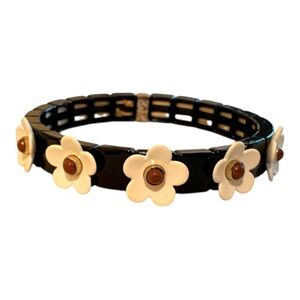 Black Bracelet with White Flower Accents